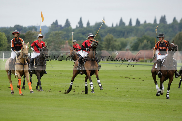 Four Quarters Black (black) v Clashleigh (red) in the Autumn Cup subsidiary final polo match on Ambersham 2 at Cowdray Park Polo Club on Sunday 22 September 2013 www.polopictures.co.uk