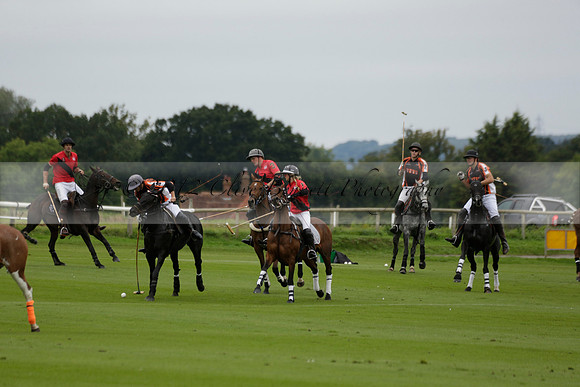 Four Quarters Black (black) v Clashleigh (red) in the Autumn Cup subsidiary final polo match on Ambersham 2 at Cowdray Park Polo Club on Sunday 22 September 2013 www.polopictures.co.uk
