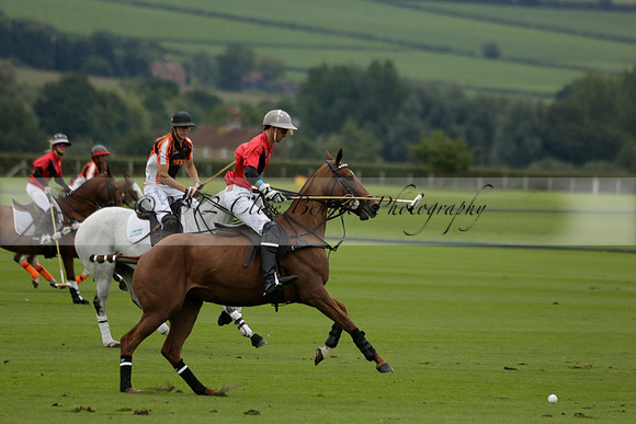 Four Quarters Black (black) v Clashleigh (red) in the Autumn Cup subsidiary final polo match on Ambersham 2 at Cowdray Park Polo Club on Sunday 22 September 2013 www.polopictures.co.uk
