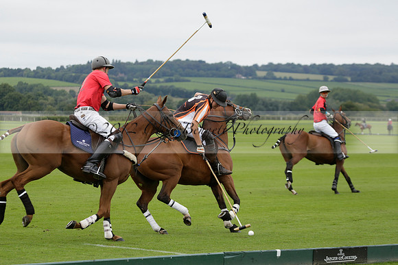 Four Quarters Black (black) v Clashleigh (red) in the Autumn Cup subsidiary final polo match on Ambersham 2 at Cowdray Park Polo Club on Sunday 22 September 2013 www.polopictures.co.uk