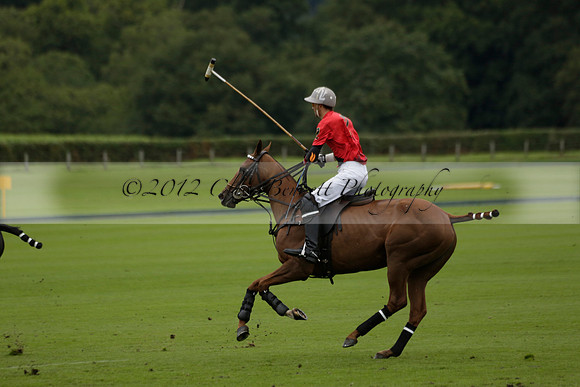 Four Quarters Black (black) v Clashleigh (red) in the Autumn Cup subsidiary final polo match on Ambersham 2 at Cowdray Park Polo Club on Sunday 22 September 2013 www.polopictures.co.uk