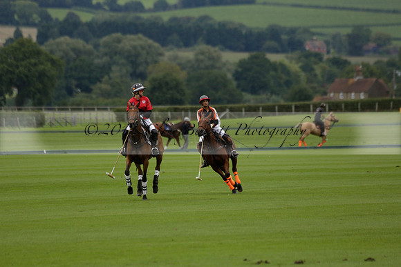 Four Quarters Black (black) v Clashleigh (red) in the Autumn Cup subsidiary final polo match on Ambersham 2 at Cowdray Park Polo Club on Sunday 22 September 2013 www.polopictures.co.uk