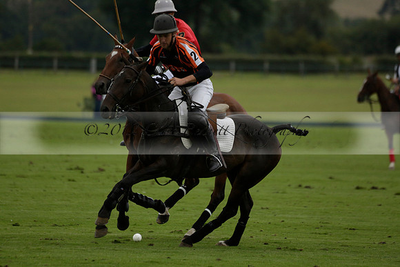Four Quarters Black (black) v Clashleigh (red)in a Jaeger Le Coultre Autumn Cup polo match played on Ambersham 2 at Cowdray Park Polo Club on Wednesday 2013.09.11 www.polopictures.co.uk