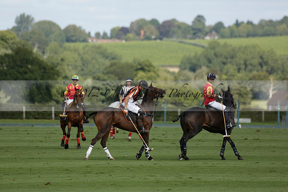 Four Quarters Black (black) v BHC (red) in a Autumn Cup polo match on Ambersham 2 at Cowdray Park Polo Club on Friday 20 September 2013 www.polopictures.co.uk