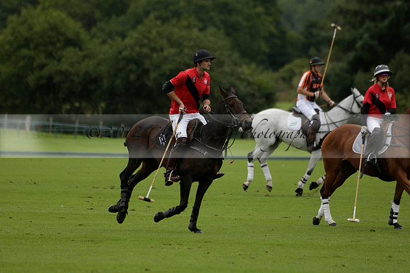 Four Quarters Black (black) v Clashleigh (red) in the Autumn Cup subsidiary final polo match on Ambersham 2 at Cowdray Park Polo Club on Sunday 22 September 2013 www.polopictures.co.uk