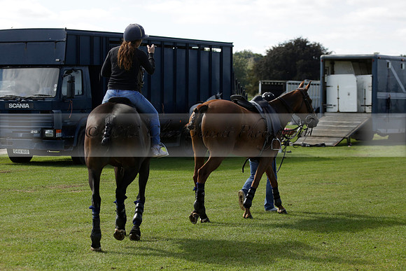 Four Quarters Black (black) v BHC (red) in a Autumn Cup polo match on Ambersham 2 at Cowdray Park Polo Club on Friday 20 September 2013 www.polopictures.co.uk