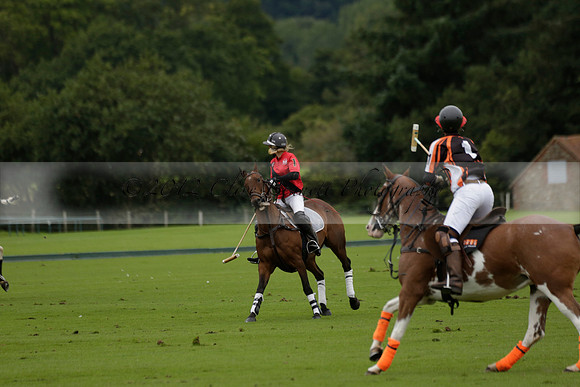 Four Quarters Black (black) v Clashleigh (red) in the Autumn Cup subsidiary final polo match on Ambersham 2 at Cowdray Park Polo Club on Sunday 22 September 2013 www.polopictures.co.uk