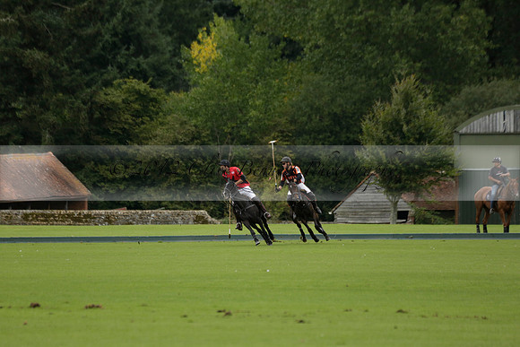 Four Quarters Black (black) v Clashleigh (red) in the Autumn Cup subsidiary final polo match on Ambersham 2 at Cowdray Park Polo Club on Sunday 22 September 2013 www.polopictures.co.uk