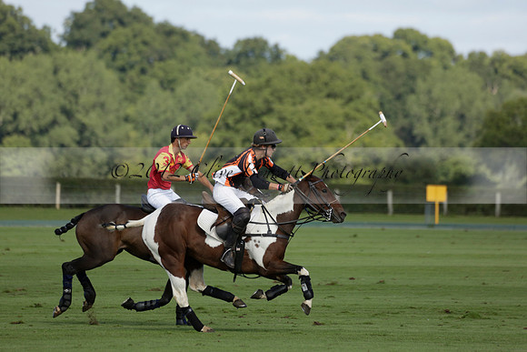 Four Quarters Black (black) v BHC (red) in a Autumn Cup polo match on Ambersham 2 at Cowdray Park Polo Club on Friday 20 September 2013 www.polopictures.co.uk