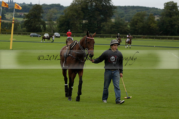 Four Quarters Black (black) v Clashleigh (red) in the Autumn Cup subsidiary final polo match on Ambersham 2 at Cowdray Park Polo Club on Sunday 22 September 2013 www.polopictures.co.uk