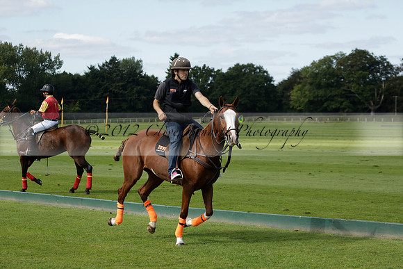 Four Quarters Black (black) v BHC (red) in a Autumn Cup polo match on Ambersham 2 at Cowdray Park Polo Club on Friday 20 September 2013 www.polopictures.co.uk