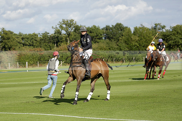 Aryana (black) v Shoreline (yellow) in a Farewell Cup polo match played on Ambersham 5 at Cowdray Park Polo Club on Wednesday 18 September 2013. www.polopictures.co.uk