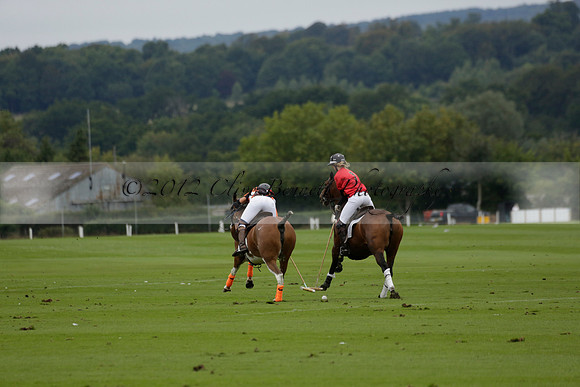Four Quarters Black (black) v Clashleigh (red) in the Autumn Cup subsidiary final polo match on Ambersham 2 at Cowdray Park Polo Club on Sunday 22 September 2013 www.polopictures.co.uk