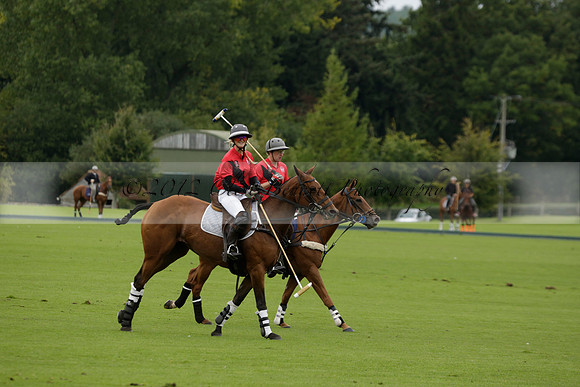 Four Quarters Black (black) v Clashleigh (red) in the Autumn Cup subsidiary final polo match on Ambersham 2 at Cowdray Park Polo Club on Sunday 22 September 2013 www.polopictures.co.uk