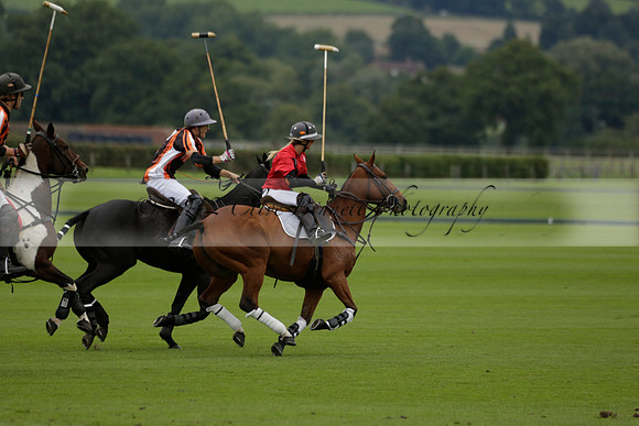 Four Quarters Black (black) v Clashleigh (red) in the Autumn Cup subsidiary final polo match on Ambersham 2 at Cowdray Park Polo Club on Sunday 22 September 2013 www.polopictures.co.uk