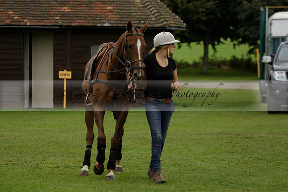 Four Quarters Black (black) v Clashleigh (red) in the Autumn Cup subsidiary final polo match on Ambersham 2 at Cowdray Park Polo Club on Sunday 22 September 2013 www.polopictures.co.uk