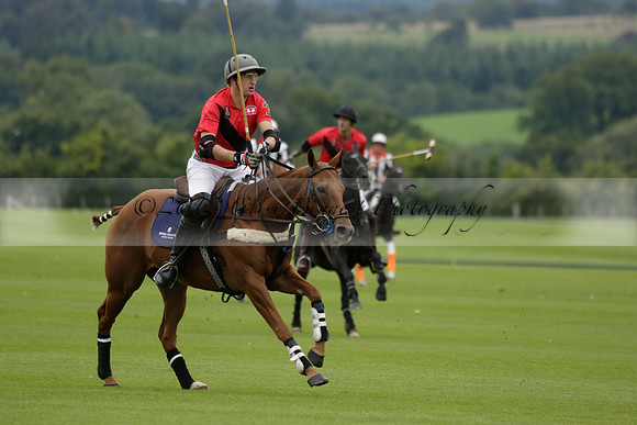 Four Quarters Black (black) v Clashleigh (red) in the Autumn Cup subsidiary final polo match on Ambersham 2 at Cowdray Park Polo Club on Sunday 22 September 2013 www.polopictures.co.uk