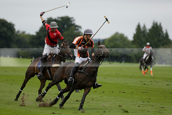 Four Quarters Black (black) v Clashleigh (red) in the Autumn Cup subsidiary final polo match on Ambersham 2 at Cowdray Park Polo Club on Sunday 22 September 2013 www.polopictures.co.uk