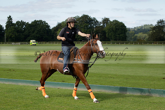 Four Quarters Black (black) v BHC (red) in a Autumn Cup polo match on Ambersham 2 at Cowdray Park Polo Club on Friday 20 September 2013 www.polopictures.co.uk