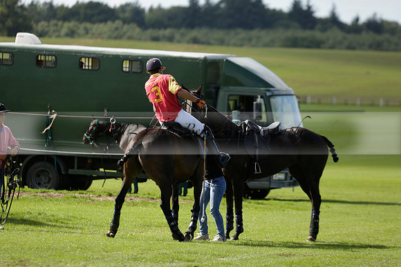 Four Quarters Black (black) v BHC (red) in a Autumn Cup polo match on Ambersham 2 at Cowdray Park Polo Club on Friday 20 September 2013 www.polopictures.co.uk