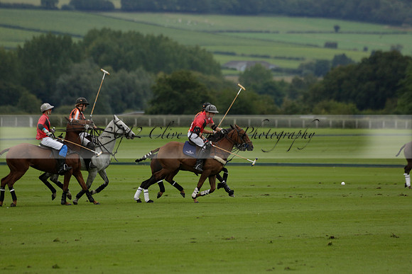 Four Quarters Black (black) v Clashleigh (red) in the Autumn Cup subsidiary final polo match on Ambersham 2 at Cowdray Park Polo Club on Sunday 22 September 2013 www.polopictures.co.uk