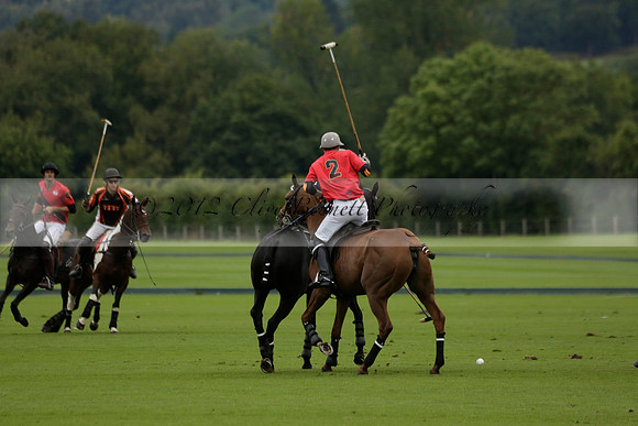 Four Quarters Black (black) v Clashleigh (red) in the Autumn Cup subsidiary final polo match on Ambersham 2 at Cowdray Park Polo Club on Sunday 22 September 2013 www.polopictures.co.uk