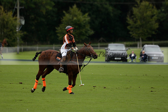 Four Quarters Black (black) v Clashleigh (red) in the Autumn Cup subsidiary final polo match on Ambersham 2 at Cowdray Park Polo Club on Sunday 22 September 2013 www.polopictures.co.uk