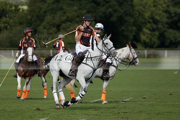 Four Quarters Black (black) v BHC (red) in a Autumn Cup polo match on Ambersham 2 at Cowdray Park Polo Club on Friday 20 September 2013 www.polopictures.co.uk