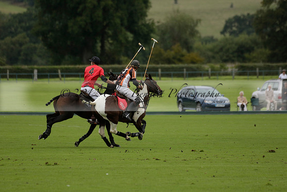 Four Quarters Black (black) v Clashleigh (red) in the Autumn Cup subsidiary final polo match on Ambersham 2 at Cowdray Park Polo Club on Sunday 22 September 2013 www.polopictures.co.uk