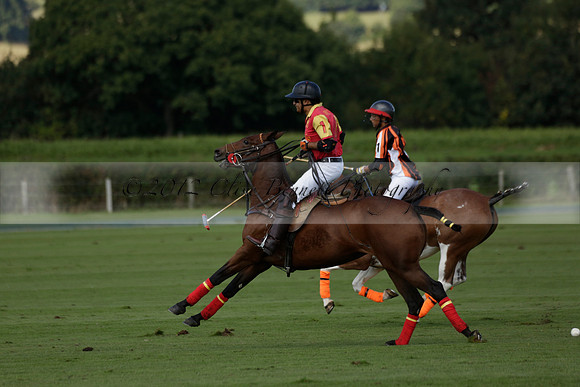 Four Quarters Black (black) v BHC (red) in a Autumn Cup polo match on Ambersham 2 at Cowdray Park Polo Club on Friday 20 September 2013 www.polopictures.co.uk