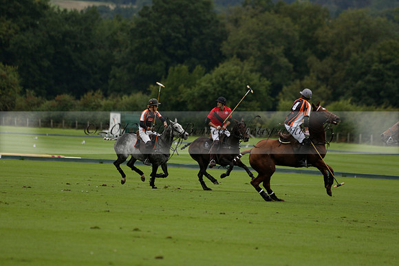 Four Quarters Black (black) v Clashleigh (red) in the Autumn Cup subsidiary final polo match on Ambersham 2 at Cowdray Park Polo Club on Sunday 22 September 2013 www.polopictures.co.uk