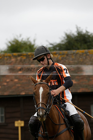Four Quarters Black (black) v Clashleigh (red) in the Autumn Cup subsidiary final polo match on Ambersham 2 at Cowdray Park Polo Club on Sunday 22 September 2013 www.polopictures.co.uk