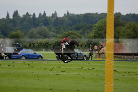 Four Quarters Black (black) v Clashleigh (red) in the Autumn Cup subsidiary final polo match on Ambersham 2 at Cowdray Park Polo Club on Sunday 22 September 2013 www.polopictures.co.uk
