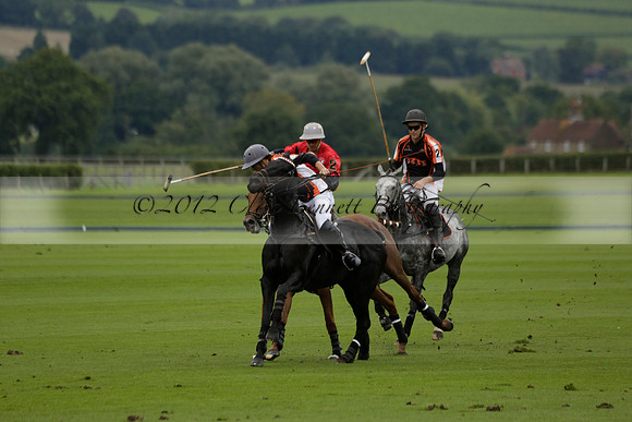 Four Quarters Black (black) v Clashleigh (red) in the Autumn Cup subsidiary final polo match on Ambersham 2 at Cowdray Park Polo Club on Sunday 22 September 2013 www.polopictures.co.uk