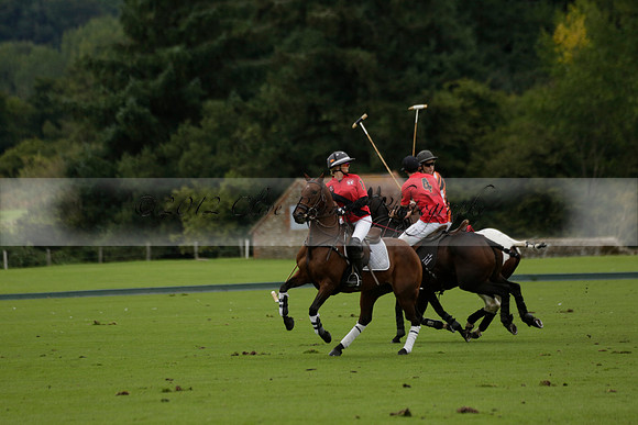 Four Quarters Black (black) v Clashleigh (red) in the Autumn Cup subsidiary final polo match on Ambersham 2 at Cowdray Park Polo Club on Sunday 22 September 2013 www.polopictures.co.uk