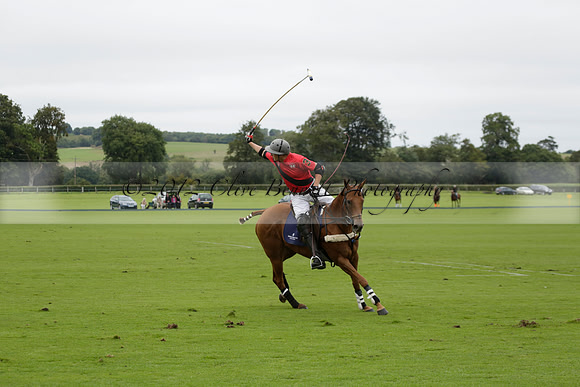 Four Quarters Black (black) v Clashleigh (red) in the Autumn Cup subsidiary final polo match on Ambersham 2 at Cowdray Park Polo Club on Sunday 22 September 2013 www.polopictures.co.uk