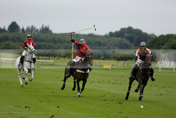 Four Quarters Black (black) v Clashleigh (red) in the Autumn Cup subsidiary final polo match on Ambersham 2 at Cowdray Park Polo Club on Sunday 22 September 2013 www.polopictures.co.uk