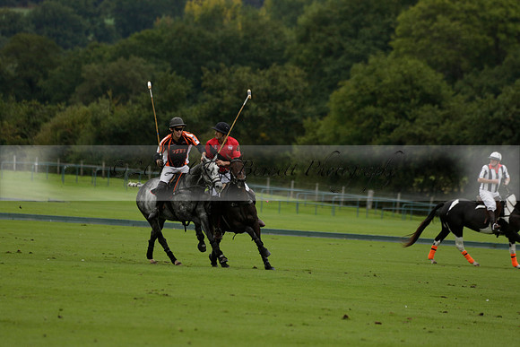 Four Quarters Black (black) v Clashleigh (red) in the Autumn Cup subsidiary final polo match on Ambersham 2 at Cowdray Park Polo Club on Sunday 22 September 2013 www.polopictures.co.uk