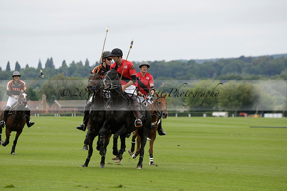 Four Quarters Black (black) v Clashleigh (red) in the Autumn Cup subsidiary final polo match on Ambersham 2 at Cowdray Park Polo Club on Sunday 22 September 2013 www.polopictures.co.uk