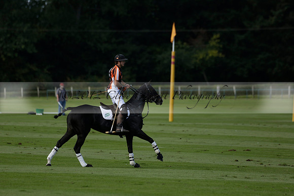 Four Quarters Black (black) v BHC (red) in a Autumn Cup polo match on Ambersham 2 at Cowdray Park Polo Club on Friday 20 September 2013 www.polopictures.co.uk