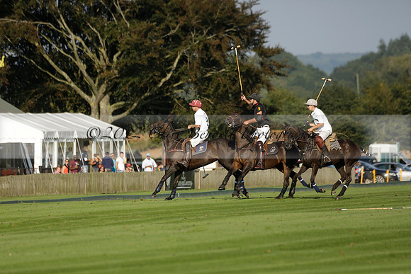 Pluma Negra (white) v Shoreline (black) in the Brecknock Cup Subsidiary final polo match played on Sunday 25 August 2013 at Cowdray Park Polo Club on Ambersham 1. 2013.10.12 www.polopictures.co.uk