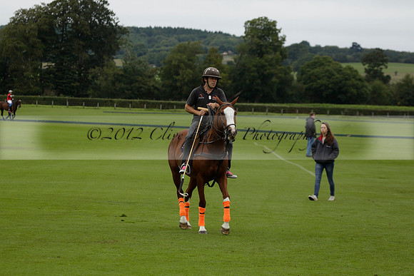 Four Quarters Black (black) v Clashleigh (red) in the Autumn Cup subsidiary final polo match on Ambersham 2 at Cowdray Park Polo Club on Sunday 22 September 2013 www.polopictures.co.uk