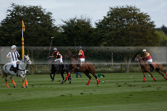 Four Quarters Black (black) v BHC (red) in a Autumn Cup polo match on Ambersham 2 at Cowdray Park Polo Club on Friday 20 September 2013 www.polopictures.co.uk
