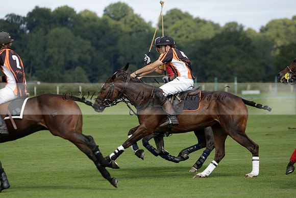 Four Quarters Black (black) v BHC (red) in a Autumn Cup polo match on Ambersham 2 at Cowdray Park Polo Club on Friday 20 September 2013 www.polopictures.co.uk