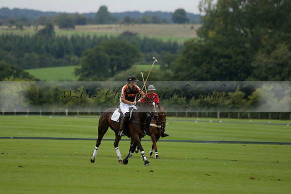Four Quarters Black (black) v Clashleigh (red) in the Autumn Cup subsidiary final polo match on Ambersham 2 at Cowdray Park Polo Club on Sunday 22 September 2013 www.polopictures.co.uk