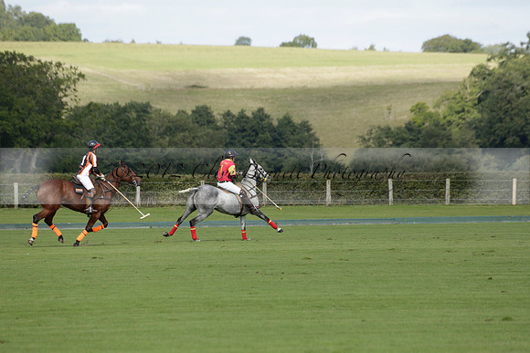 Four Quarters Black (black) v BHC (red) in a Autumn Cup polo match on Ambersham 2 at Cowdray Park Polo Club on Friday 20 September 2013 www.polopictures.co.uk