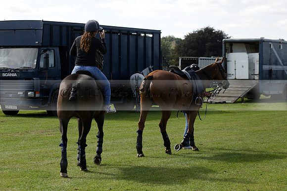 Four Quarters Black (black) v BHC (red) in a Autumn Cup polo match on Ambersham 2 at Cowdray Park Polo Club on Friday 20 September 2013 www.polopictures.co.uk