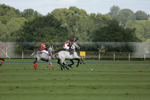 Four Quarters Black (black) v BHC (red) in a Autumn Cup polo match on Ambersham 2 at Cowdray Park Polo Club on Friday 20 September 2013 www.polopictures.co.uk
