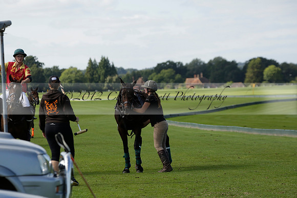 Four Quarters Black (black) v BHC (red) in a Autumn Cup polo match on Ambersham 2 at Cowdray Park Polo Club on Friday 20 September 2013 www.polopictures.co.uk