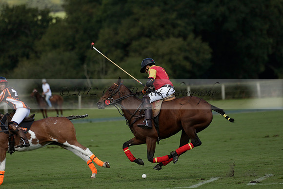 Four Quarters Black (black) v BHC (red) in a Autumn Cup polo match on Ambersham 2 at Cowdray Park Polo Club on Friday 20 September 2013 www.polopictures.co.uk
